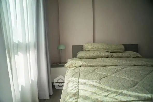 Cozy bedroom with soft lighting and elegant decor, perfect for relaxation and comfort.