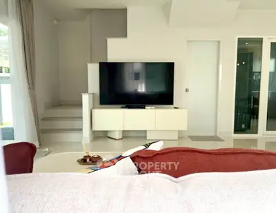 Modern living room with sleek TV setup and minimalist decor