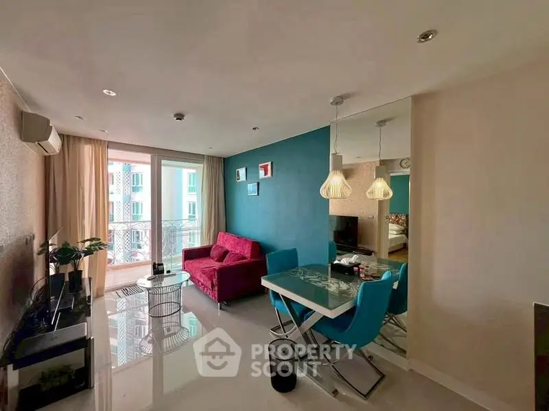 Modern living room with vibrant decor and dining area in a stylish apartment.