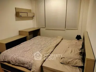 Cozy bedroom with modern wooden furniture and soft lighting, perfect for relaxation and comfort.