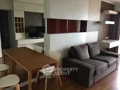 Modern living room with sleek furniture and wooden flooring
