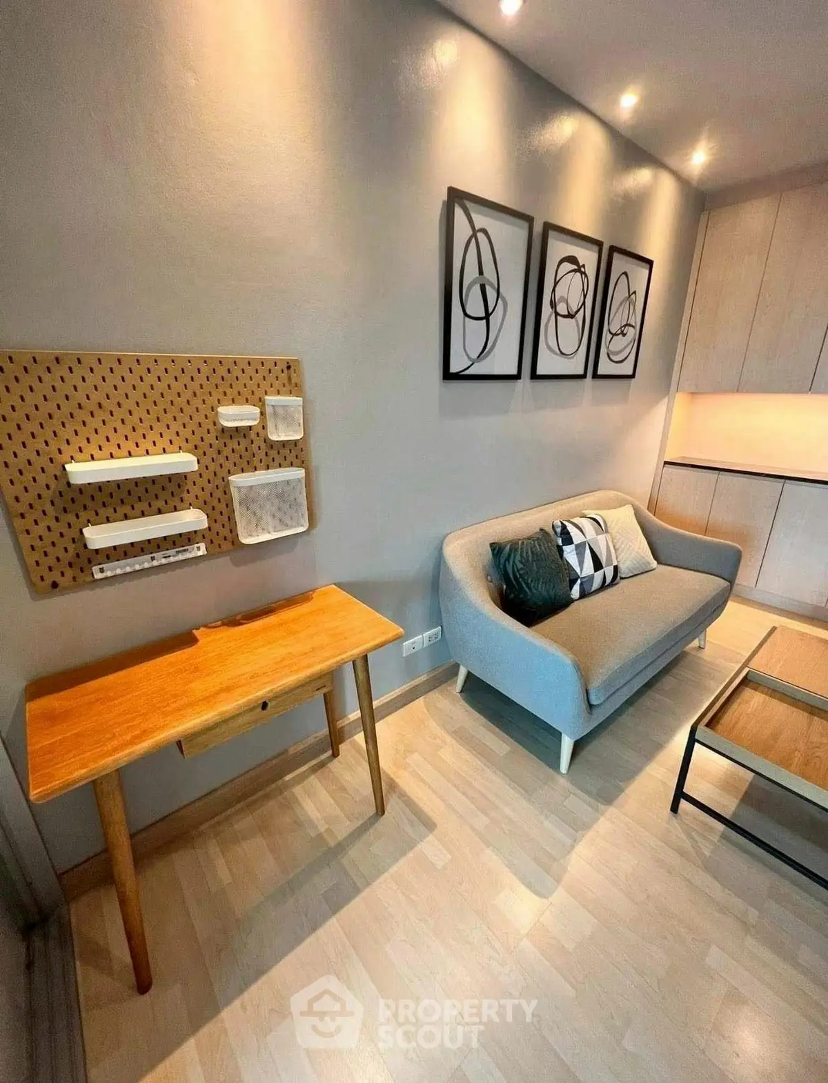 Stylish modern living room with cozy sofa and wooden furniture