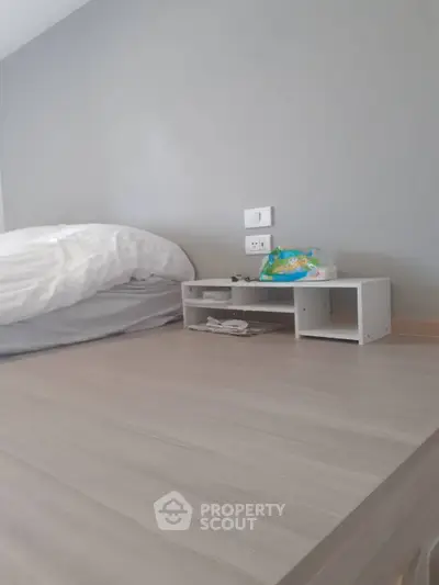 Minimalist bedroom with modern design and sleek wooden flooring