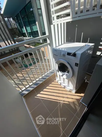 Modern outdoor laundry area with washing machine and sleek design