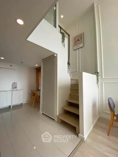 Modern duplex interior with stylish staircase and bright open layout