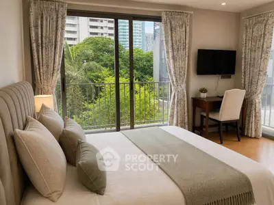 Luxurious bedroom with large windows offering a stunning city view, elegant decor, and modern amenities.