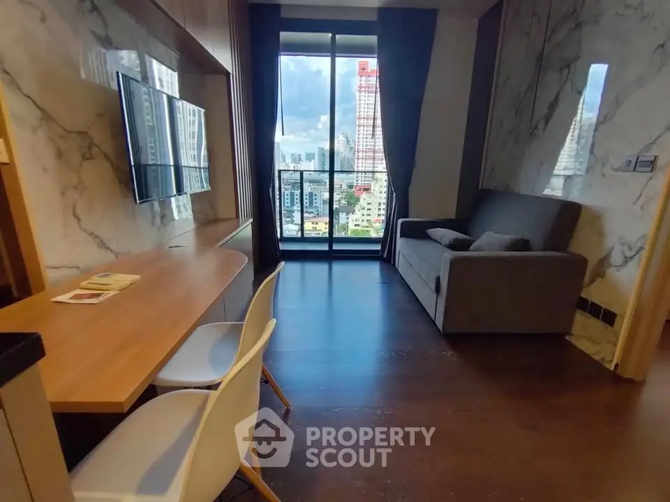 Modern living room with city view, featuring sleek furniture and marble accents.