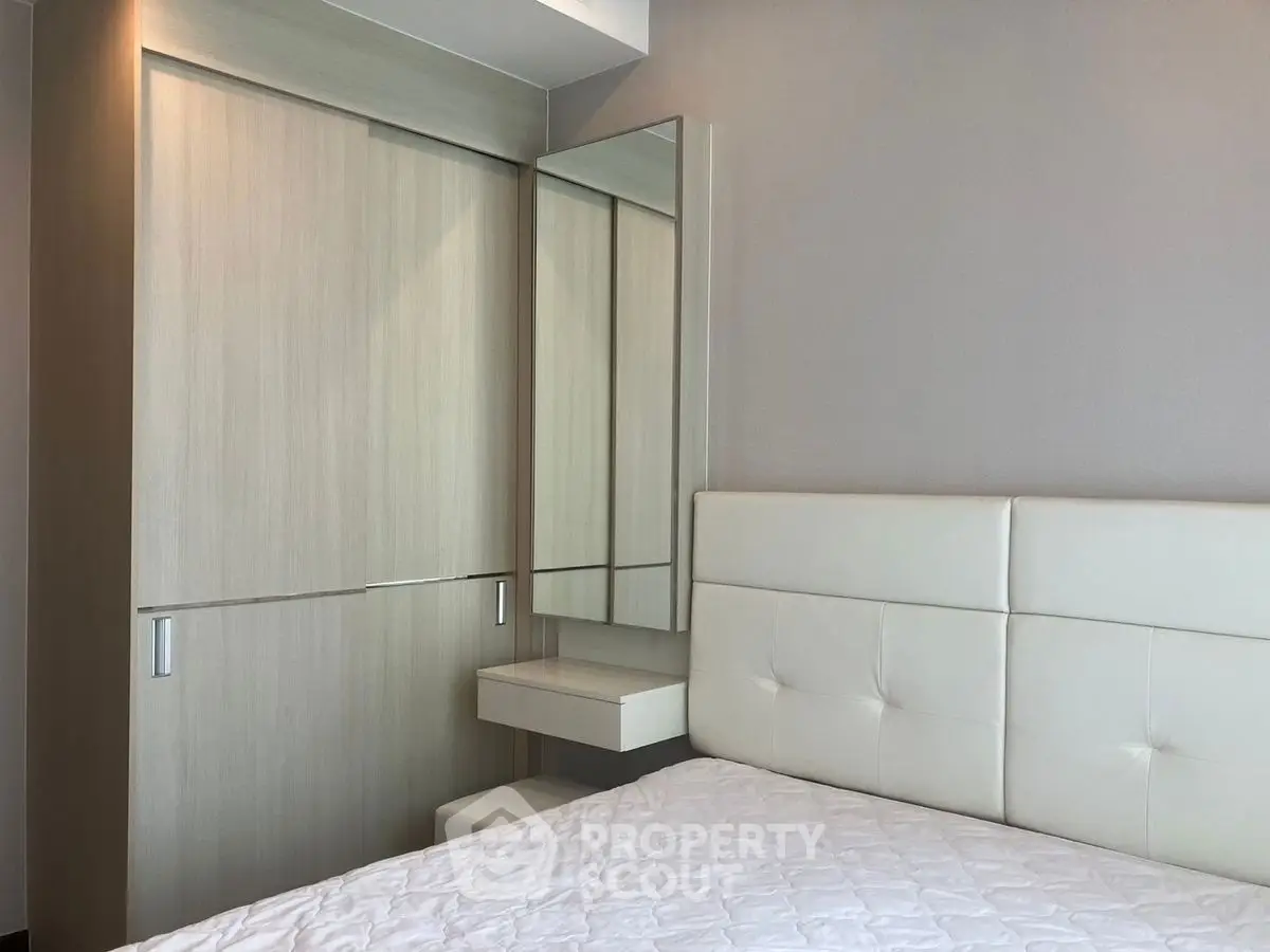 Modern bedroom with sleek wardrobe and minimalist design