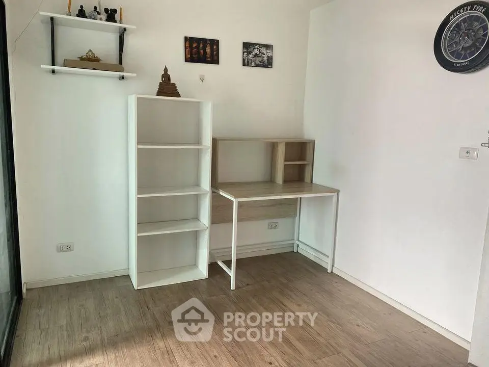 Minimalist study room with wooden floor and modern desk
