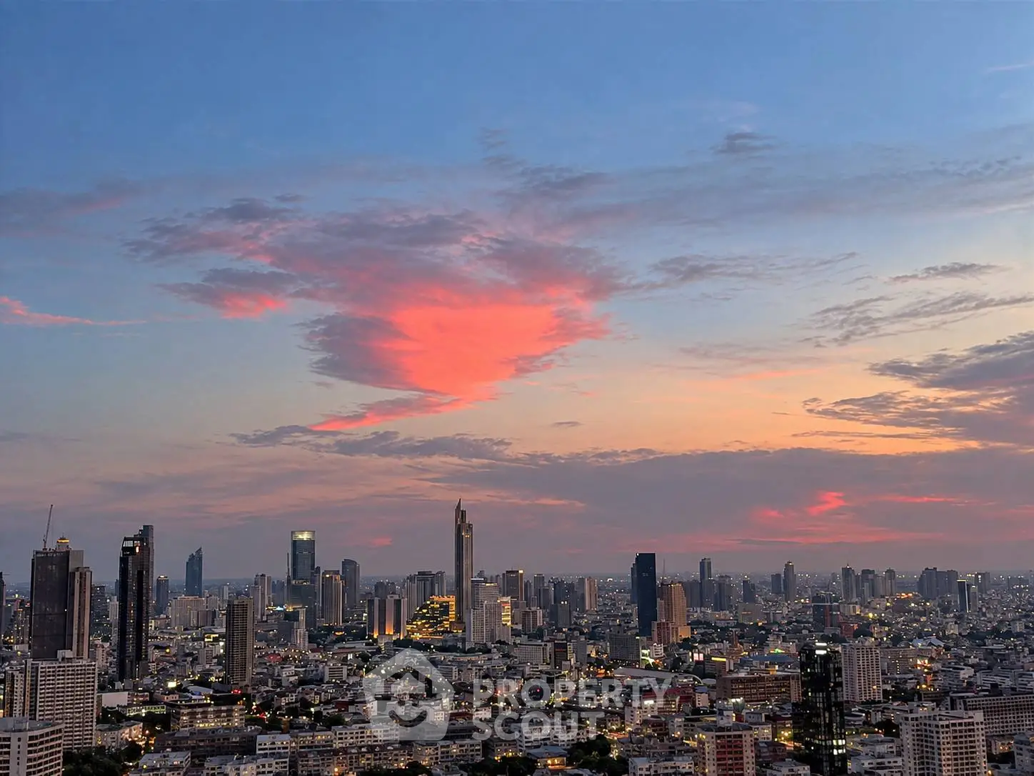 Stunning cityscape view at sunset showcasing vibrant skyline and urban architecture.