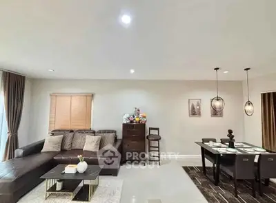 Modern living room with stylish decor and dining area