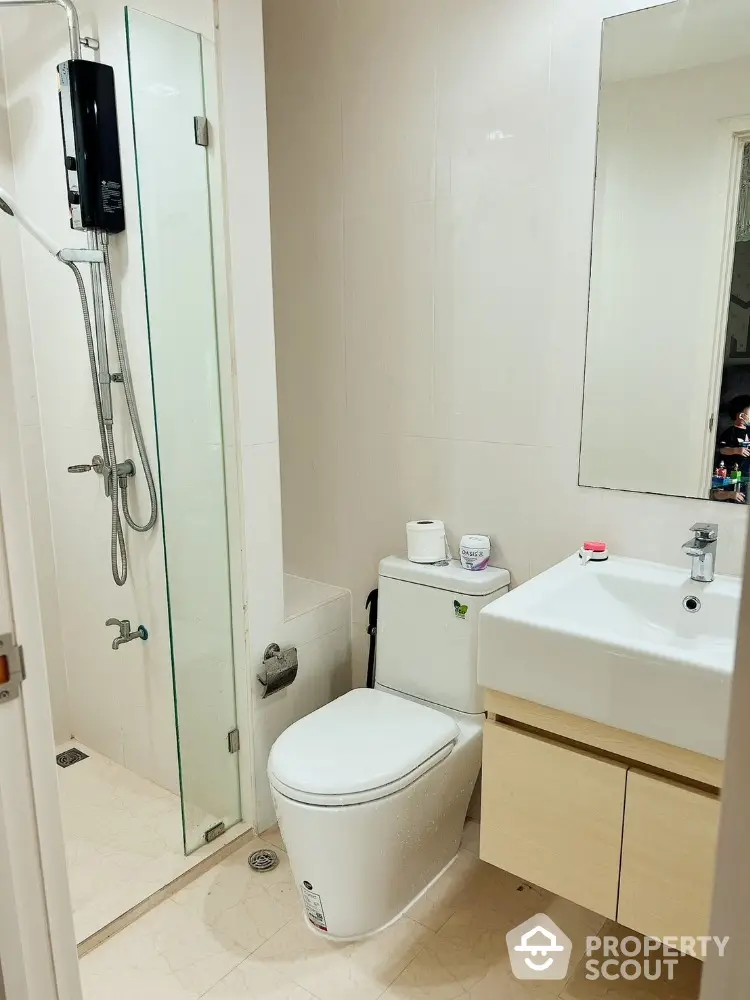 Modern bathroom with glass shower and sleek fixtures