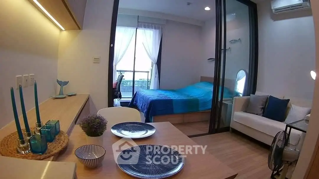 Modern studio apartment with cozy living area and stylish decor