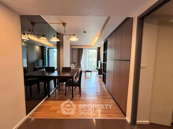 Spacious modern living room with elegant dining area and wooden flooring
