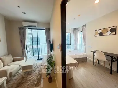 Modern apartment interior with cozy living room and bedroom, featuring stylish decor and natural light.