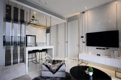 Modern living room with sleek design and open kitchen layout