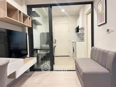 Modern living room with sleek furniture and open kitchen layout