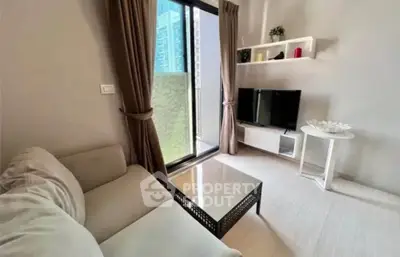 Cozy living room with modern decor and balcony view in urban apartment