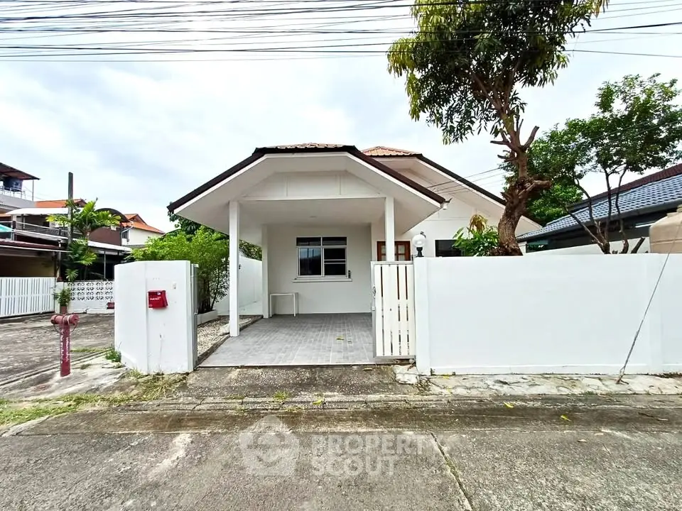 Charming single-story house with a spacious front yard and modern design in a serene neighborhood.
