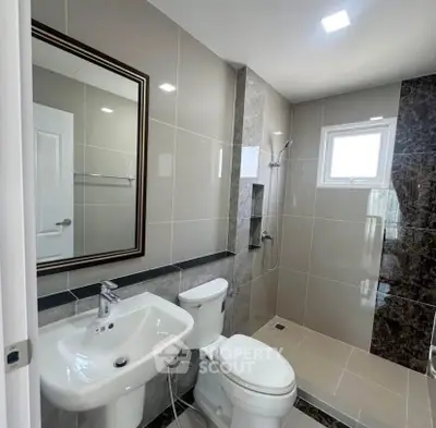 Modern bathroom with sleek fixtures and elegant tile design