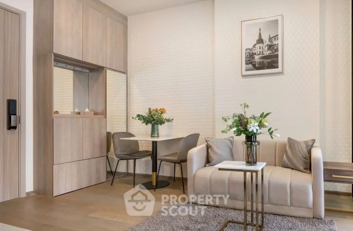 Modern living room with elegant decor, cozy seating, and stylish dining area in a chic apartment.