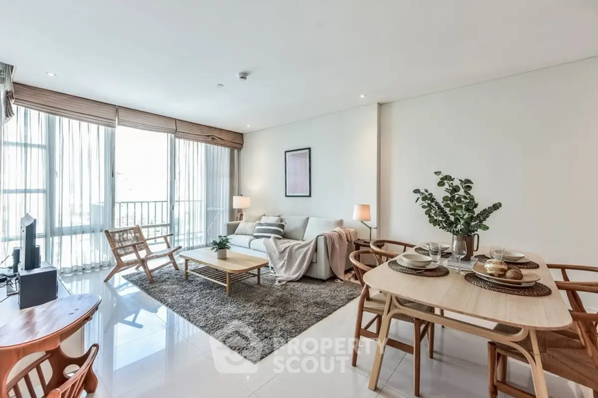 Spacious modern living room with elegant dining area and natural light