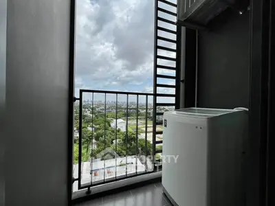 High-rise balcony with washing machine and panoramic city view