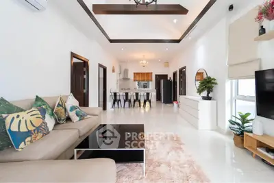 Spacious modern living room with elegant decor and open kitchen layout