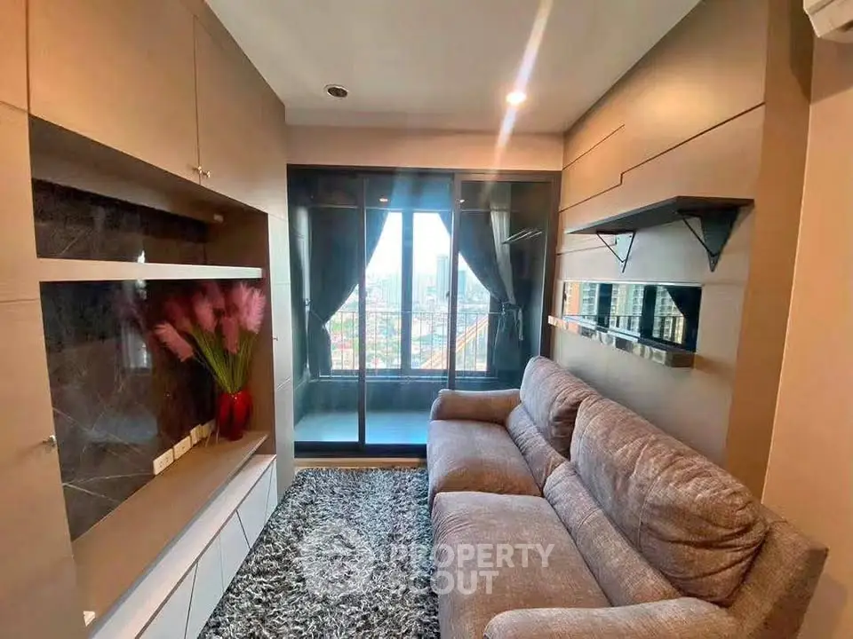 Modern living room with cozy sofa and balcony view in urban apartment
