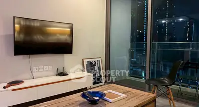 Modern living room with balcony view in high-rise apartment