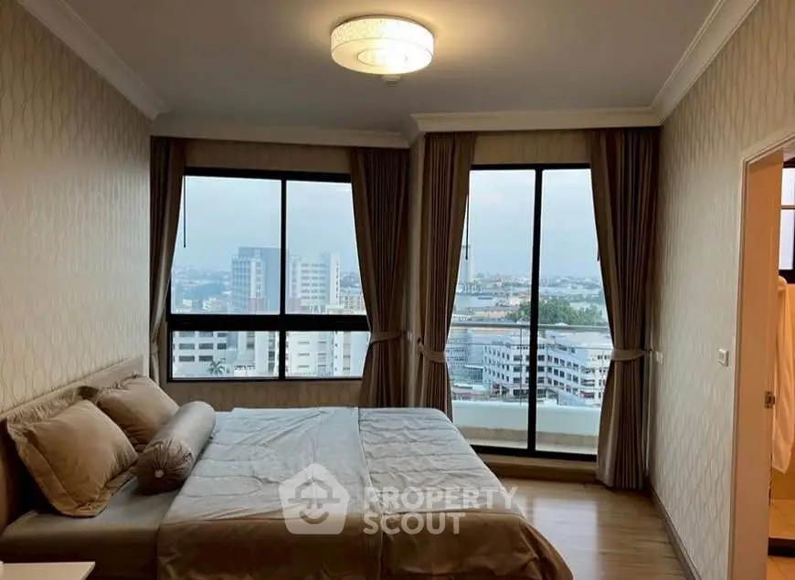 Spacious bedroom with city view and elegant decor in modern apartment