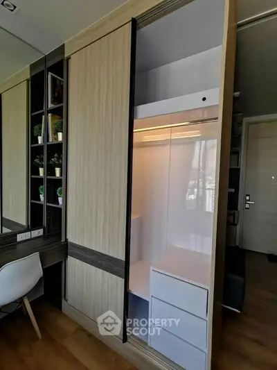 Modern bedroom with sleek built-in wardrobe and stylish desk area