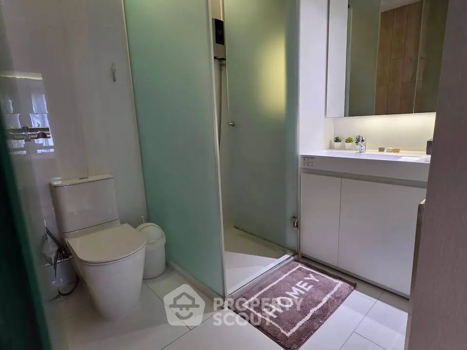 Modern bathroom with sleek design and stylish fixtures in a contemporary home.