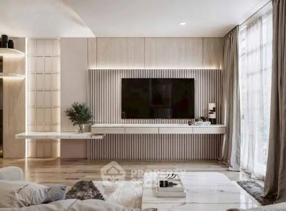 Luxurious modern living room with sleek design and large TV, perfect for relaxation and entertainment.
