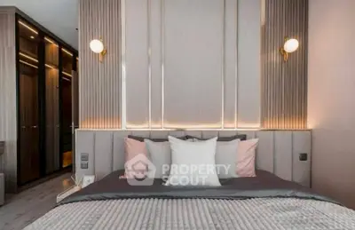 Luxurious modern bedroom with elegant lighting and plush bedding