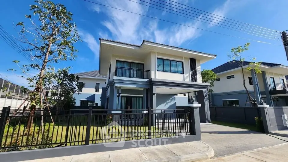 Modern two-story house with spacious garden and sleek design