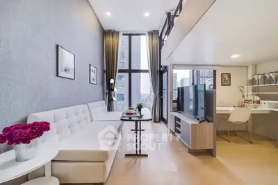 Modern living room with high ceilings and large windows offering city views.
