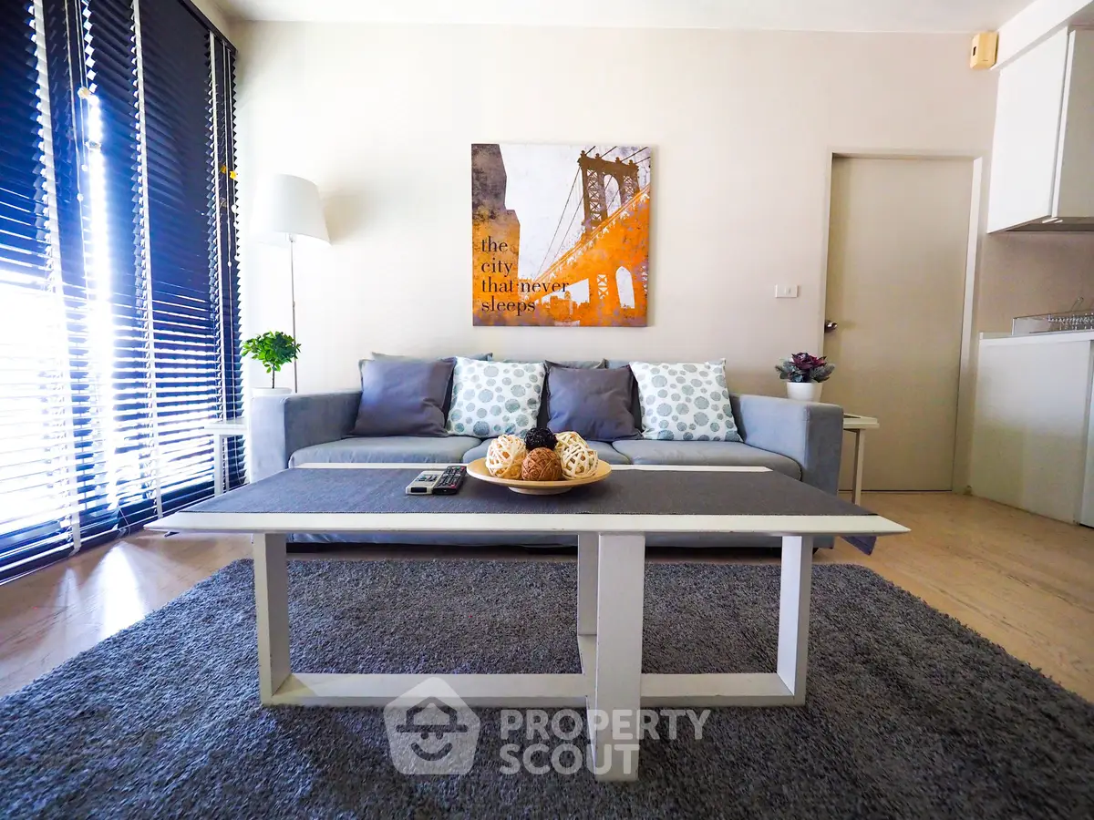 Modern living room with stylish decor and cozy seating area, perfect for relaxation and entertainment.
