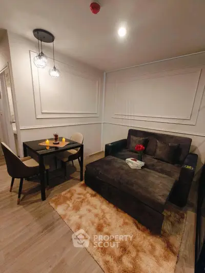 Cozy living room with modern decor and plush seating in a stylish apartment.