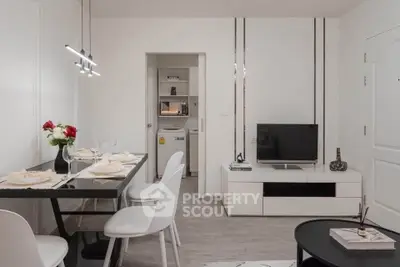 Modern living room with sleek dining area and integrated laundry space, featuring minimalist decor and stylish lighting.