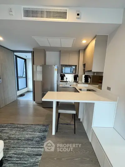 Modern kitchen with sleek design and open layout in a contemporary apartment.