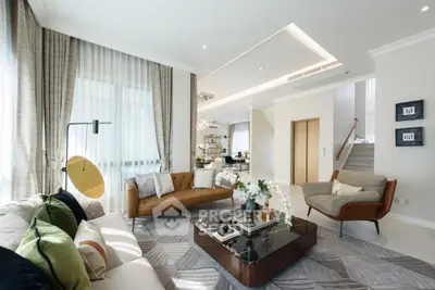 Luxurious modern living room with elegant decor and ample natural light