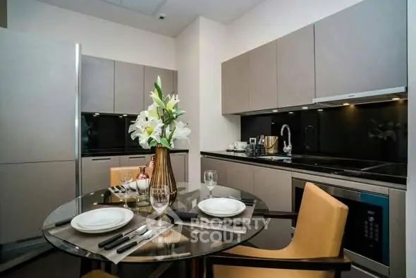 Modern kitchen with sleek cabinetry and elegant dining setup