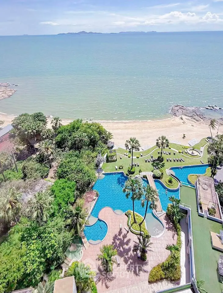 Stunning beachfront property with pool and lush gardens offering breathtaking ocean views.