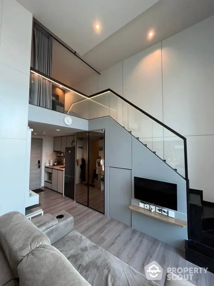 Modern loft apartment with mezzanine, sleek design, and open layout in urban setting.