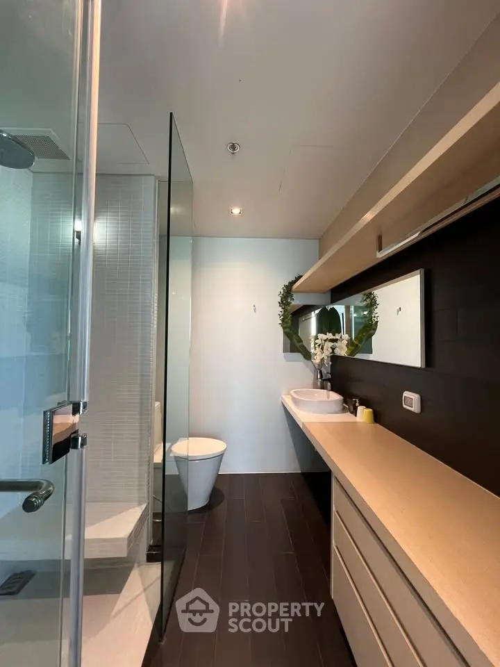 Modern bathroom with sleek design and glass shower enclosure