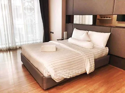 Luxurious bedroom with elegant decor and natural light