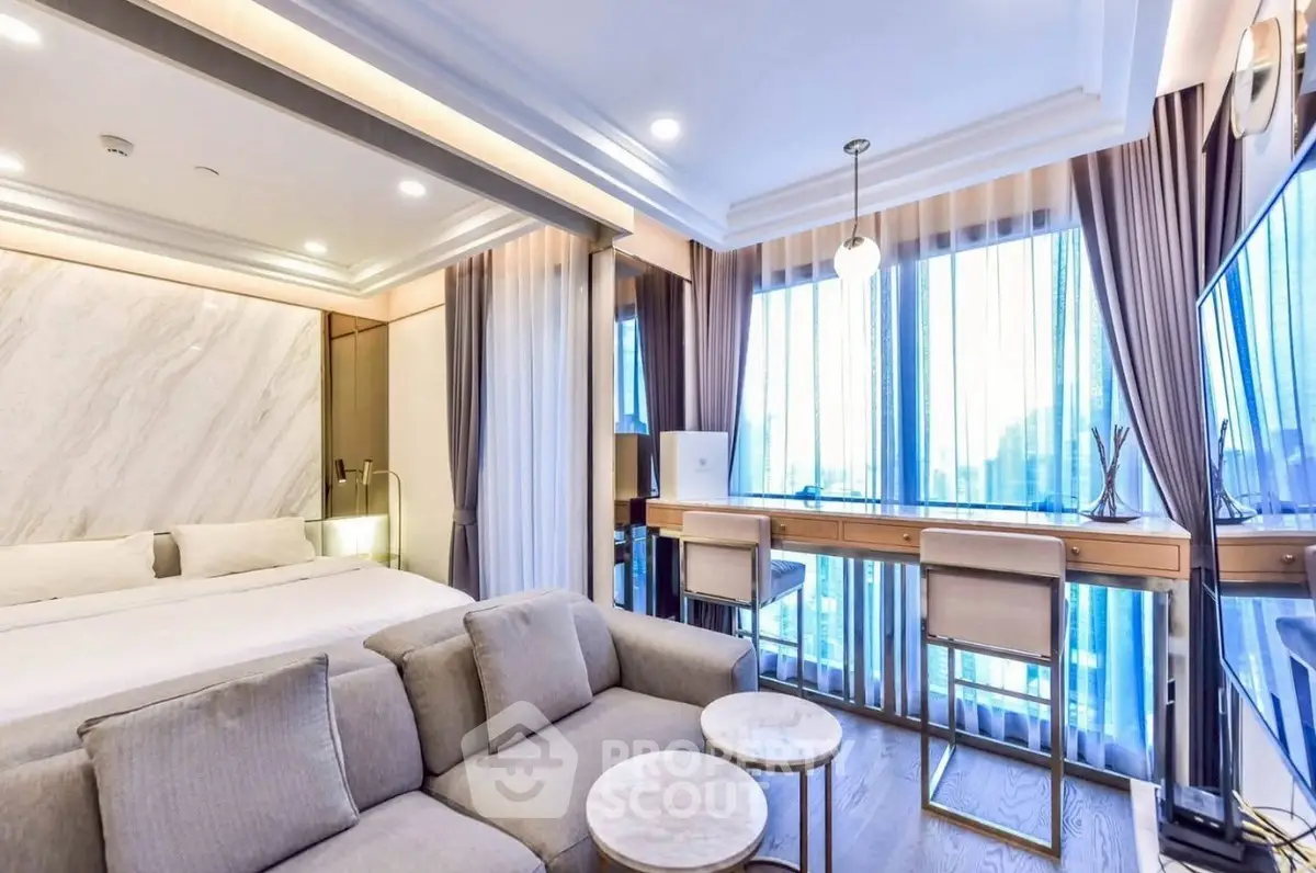 Luxurious modern living room with elegant decor and large windows offering stunning views.