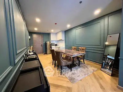 Elegant dining area with stylish decor and modern kitchen appliances