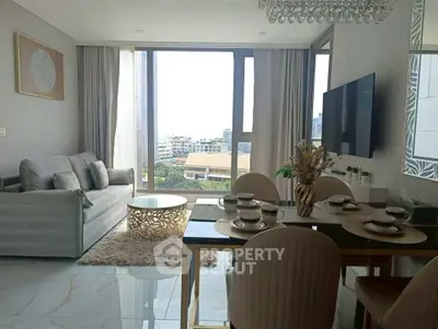 Modern living room with elegant dining area and city view